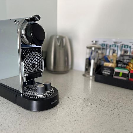 Delorenzo Studio Apartments Nelson Exteriör bild A Nespresso VertuoLine coffee machine